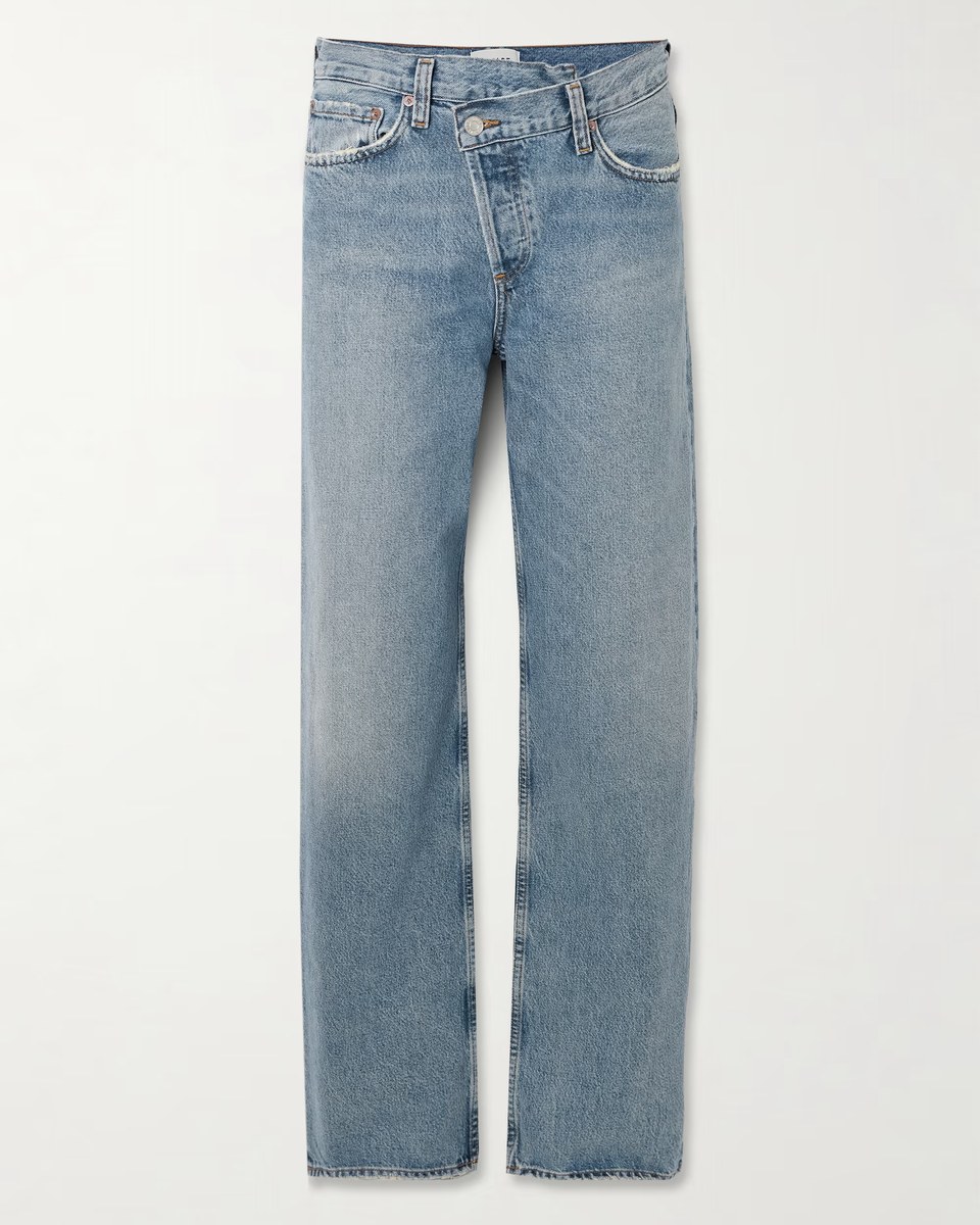 Light blue jeans with a crossover asymmetric waistband
